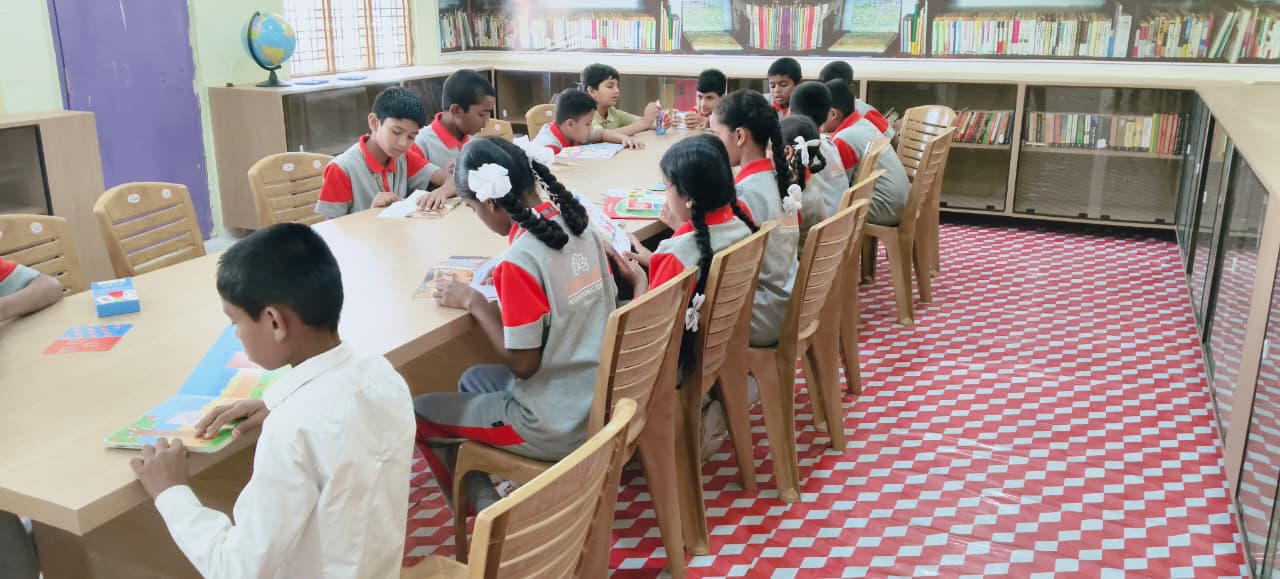Students reading together in the school library
