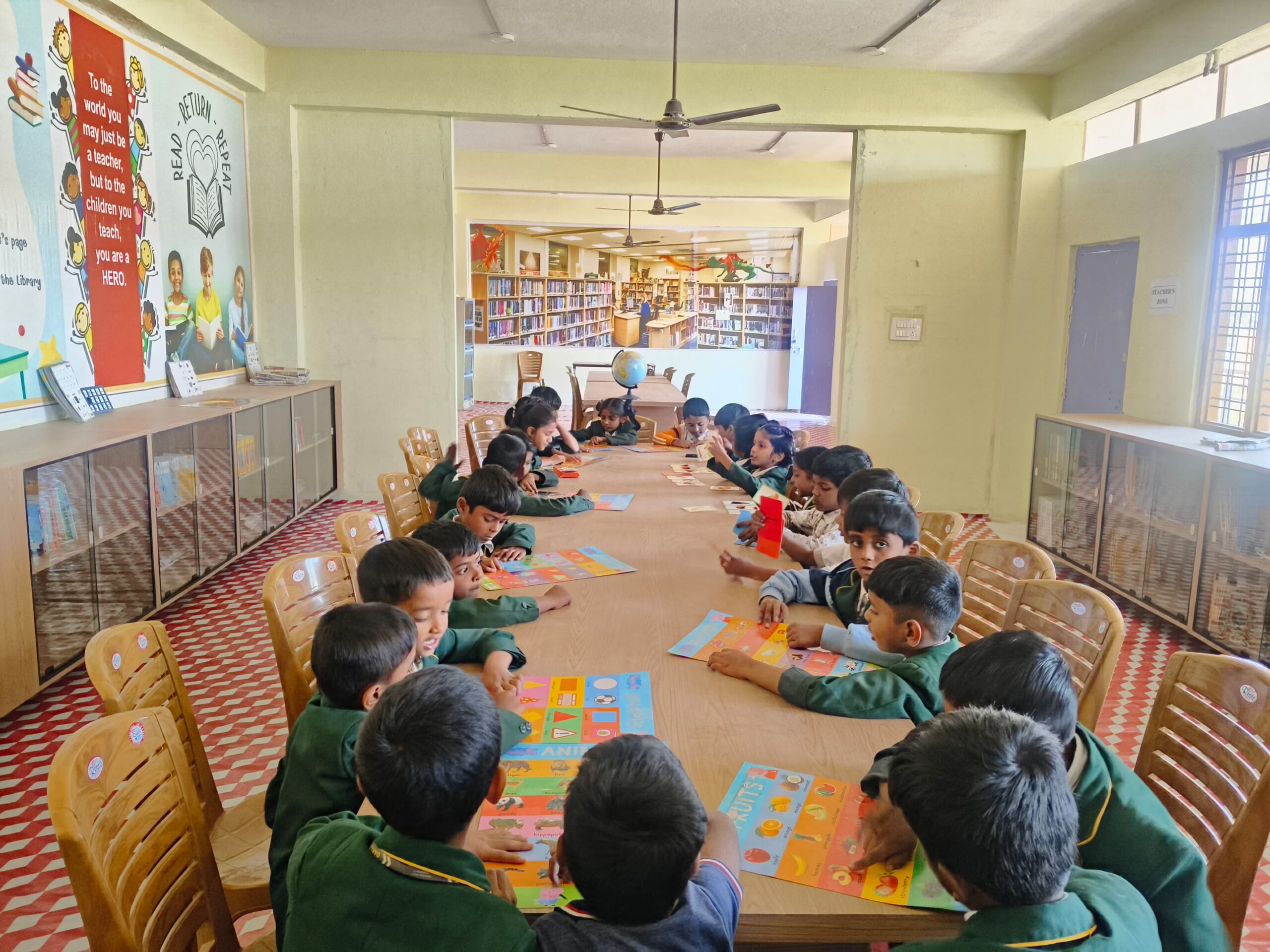 Young students learning through library activity charts
