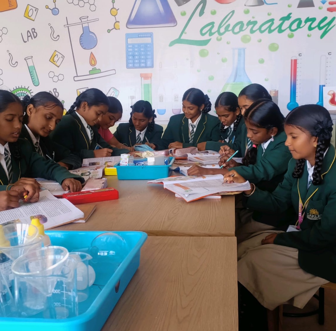 Students working with notebooks in the science laboratory
